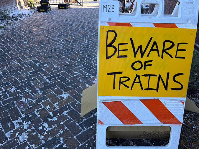 A sign outside the depot alerting the cast and crew to moving trains