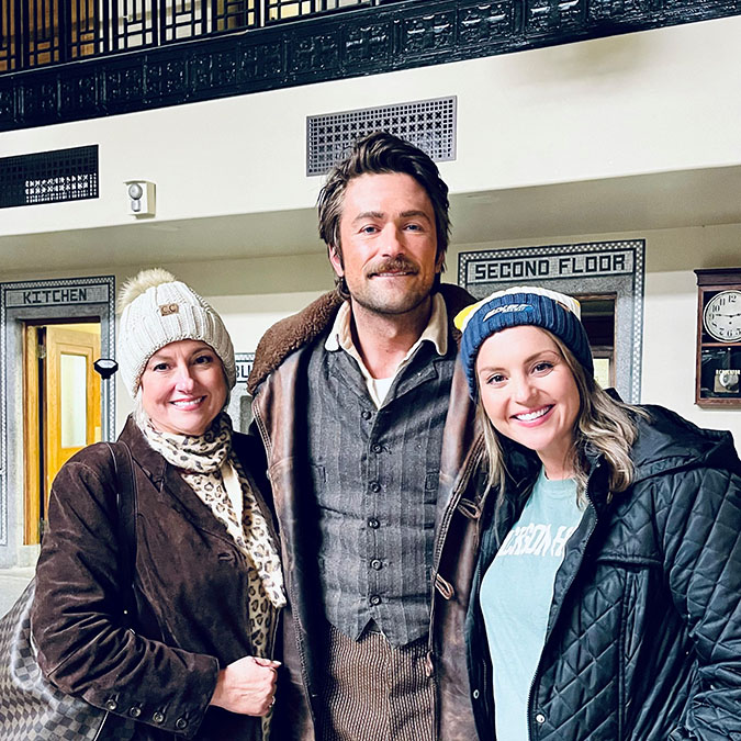 BNSF Director of External Communications Kendall Sloan, right, with her mother, Stacey Kirkham, and Brandon Sklenar, who plays Spencer Dutton in “1923” 