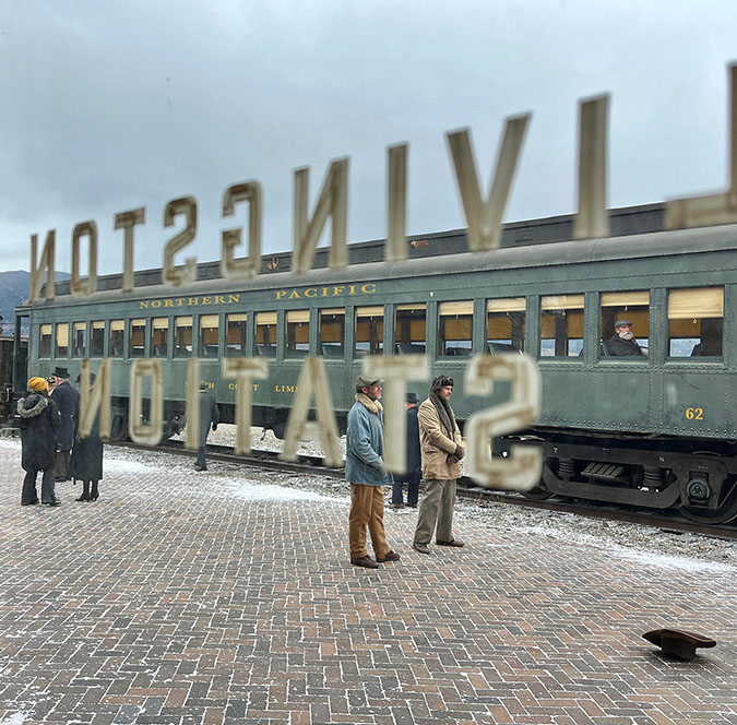 An old steam locomotive, painted to depict that of BNSF predecessor railroad Northern Pacific, sits on BNSF tracks outside the train depot in Butte, Montana. The depot is depicted in season two of “1923” as the Livingston depot.