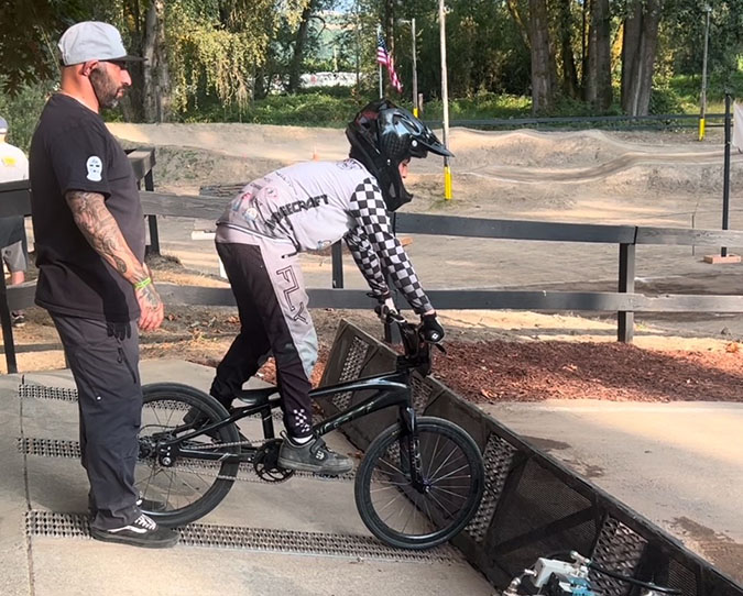 Azus checks a rider’s form. Azus checks a rider’s form.