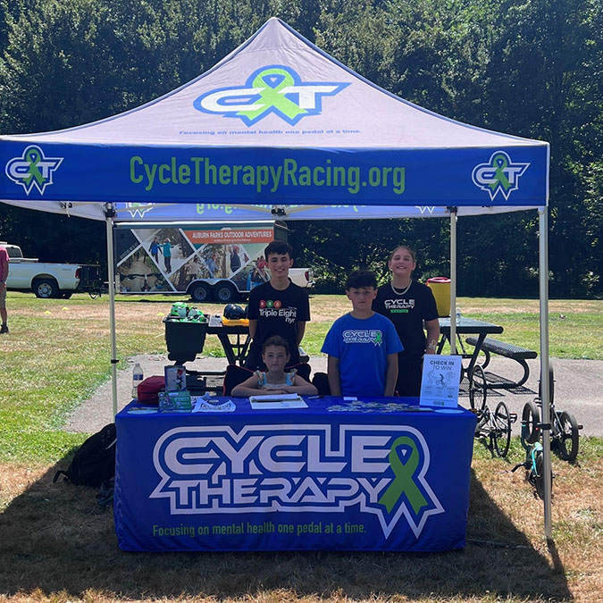 The signage’s green ribbon signifies mental health awareness. The signage’s green ribbon signifies mental health awareness.