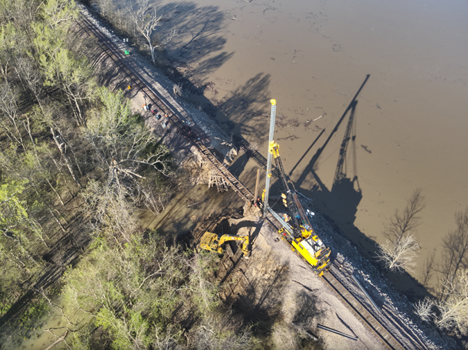Crews work to replace the washed-out culvert with a bridge. Crews work to replace the washed-out culvert with a bridge.