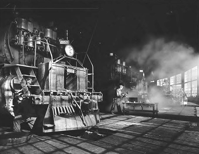 Great Northern employees repairing locomotives at the Whitefish roundhouse