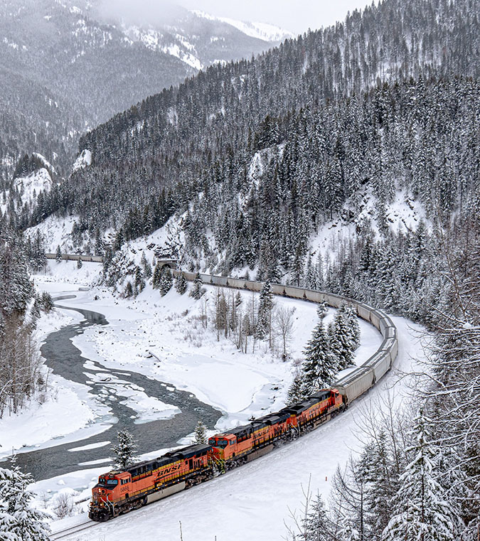 BNSF train passing through Glacier National Park during winter weather BNSF train passing through Glacier National Park during winter weather