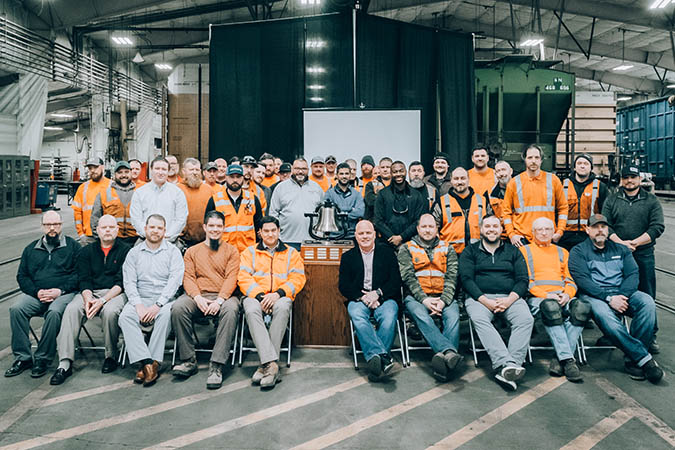 Members of the Twin Cities Division Mechanical team gather around the Safety Bell they’ve just been awarded at BNSF’s Northtown Yard in Minneapolis, Minnesota. Members of the Twin Cities Division Mechanical team gather around the Safety Bell they’ve just been awarded at BNSF’s Northtown Yard in Minneapolis, Minnesota.