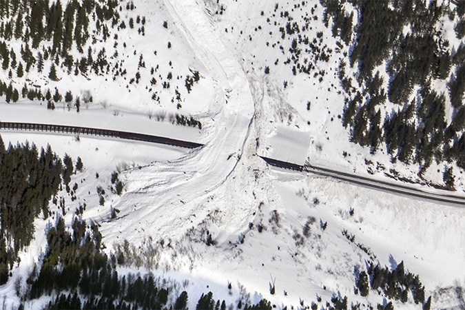 The path of this area’s avalanches can be seen in the center. Underneath this path is a snow shed that is strategically placed to divert the snow over the tracks. The path of this area’s avalanches can be seen in the center. Underneath this path is a snow shed that is strategically placed to divert the snow over the tracks.