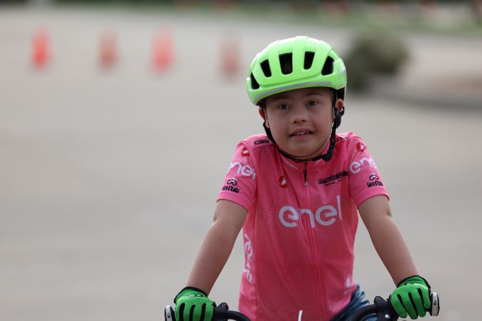 A Special Olympics athlete competing at the cycling event. A Special Olympics athlete competing at the cycling event.