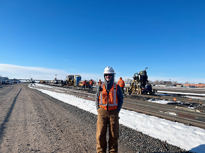 Assistant Roadmaster Brady Sewell, foreground, with orange-marked rail in the background indicating ties to pull. Assistant Roadmaster Brady Sewell, foreground, with orange-marked rail in the background indicating ties to pull.