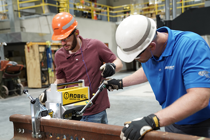 Engineer II Caleb Rogers, left, and Senior Engineer II Zach Dombrow test rail drills. BNSF's Strategic Sourcing Department sent several drills for testing and comparison. Engineer II Caleb Rogers, left, and Senior Engineer II Zach Dombrow test rail drills. BNSF's Strategic Sourcing Department sent several drills for testing and comparison.