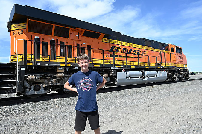 Jacob Meissner standing in front of a BNSF locomotive Jacob Meissner standing in front of a BNSF locomotive